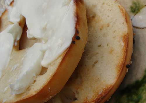 Seeded sourdough bagel with cream cheese
