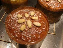 glazed panettone with almonds and pearl sugar before baking