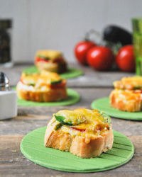 Crostini with tomato, avocado and cheese