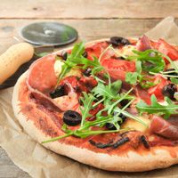 Pizza With Ham, Arugula And Olives